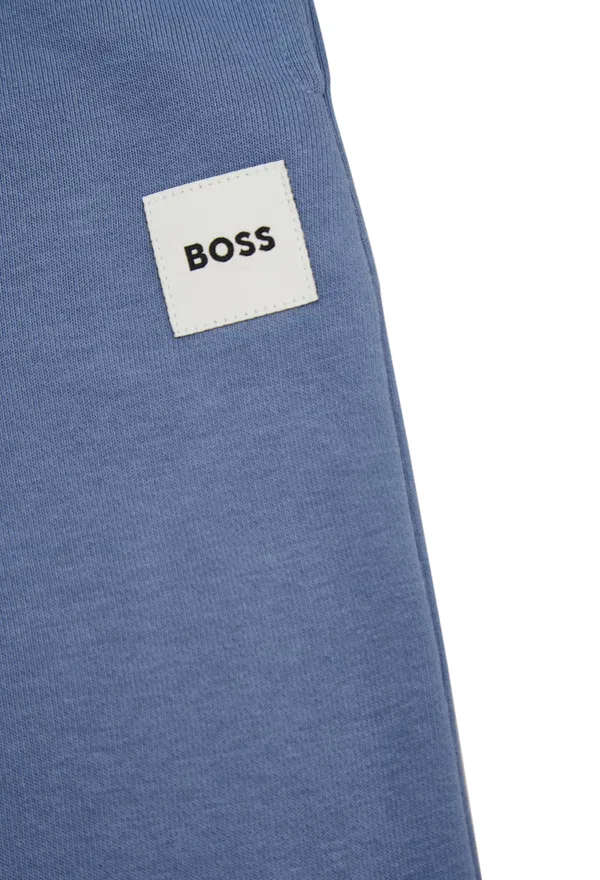 Дитячі блакитні штани Boss J5285  126/9G в Україні